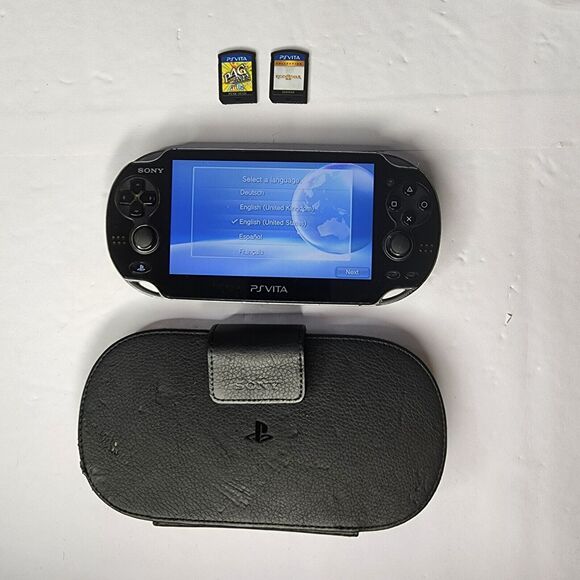 PS Vita PCH 1101-2 games P4G & God Of War, & Case